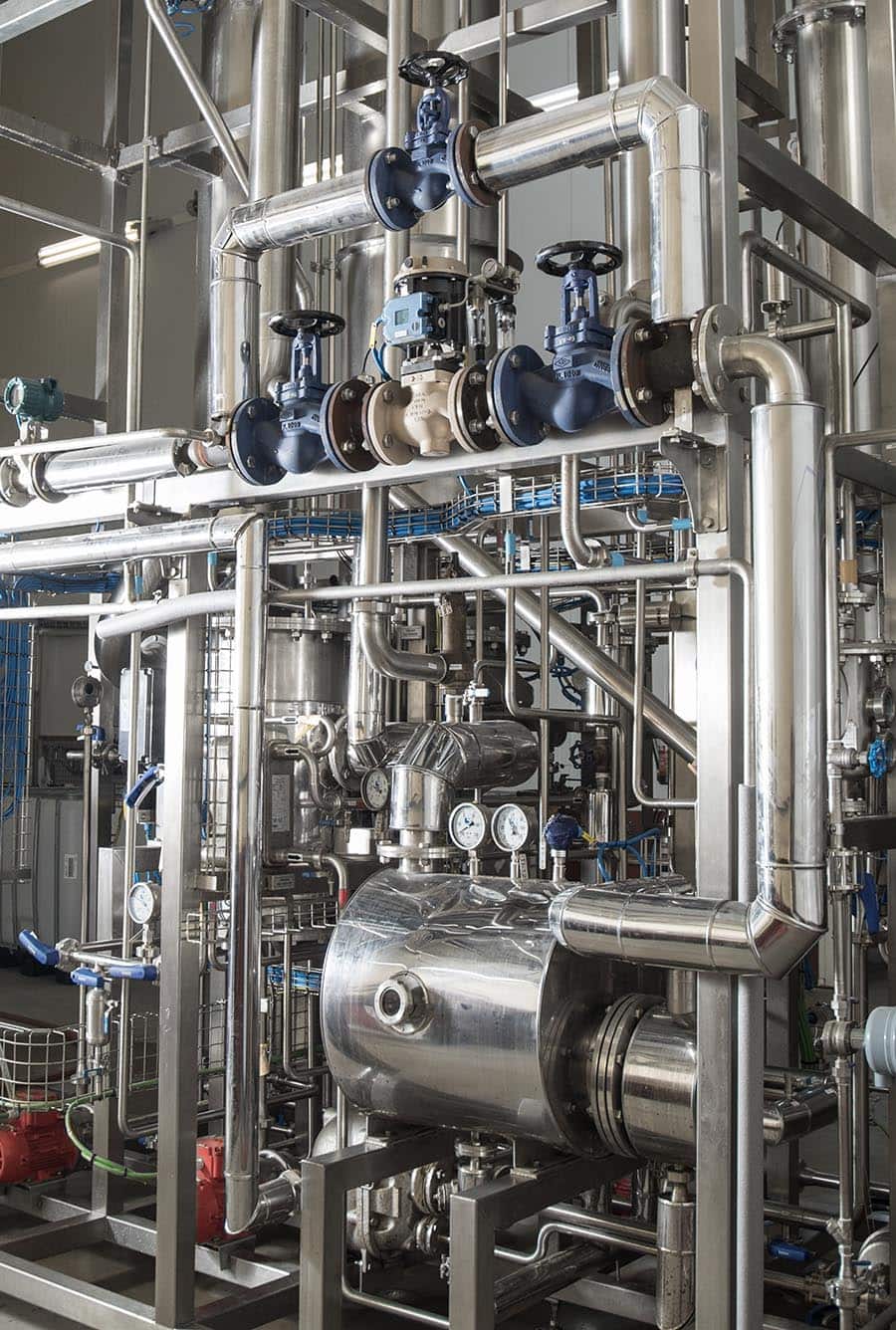Stainless steel beverage processing system at BevZero, showcasing innovative equipment and technology