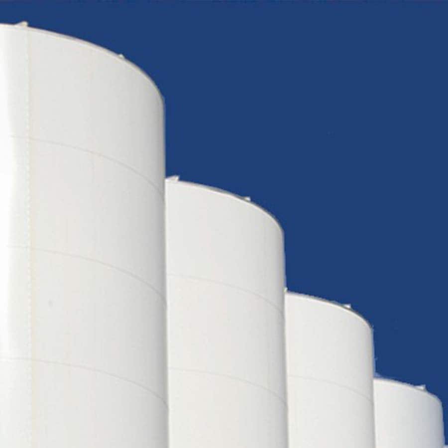 Large white beverage storage tanks, essential beverage production equipment for the beverage industry