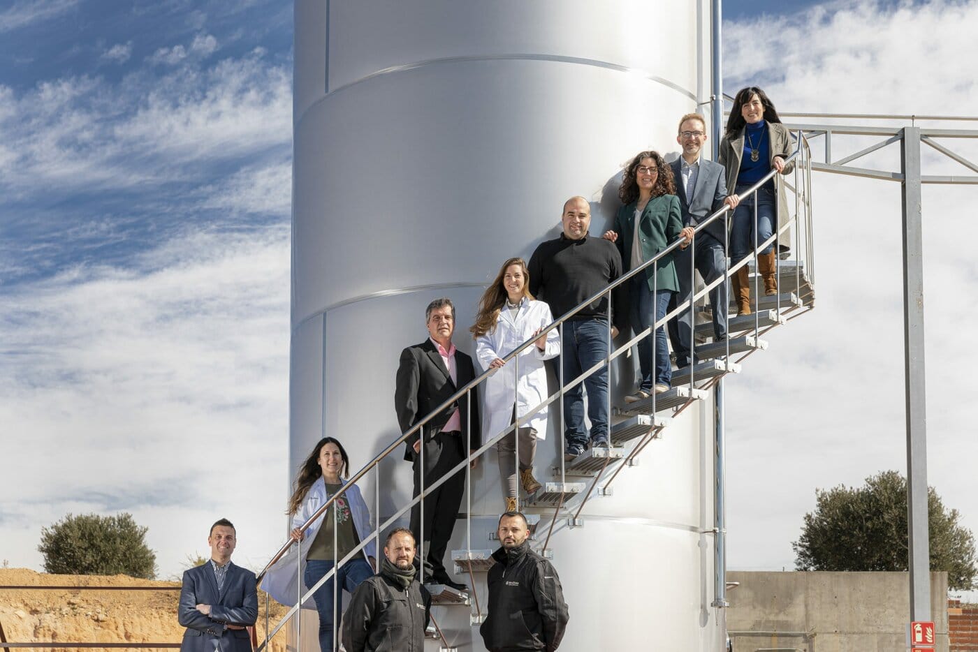 BevZero Spain team on site with stainless steel beverage tanks, Villatobas beverage solutions facility