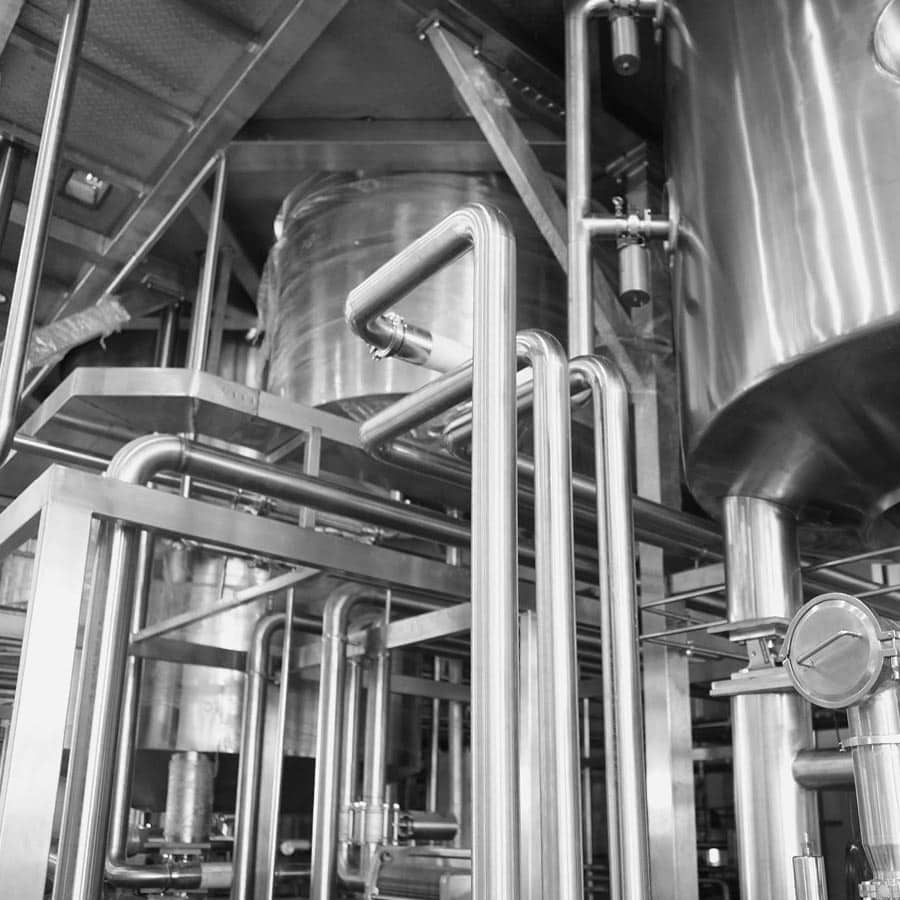 Stainless steel beverage manufacturing equipment in a modern production facility