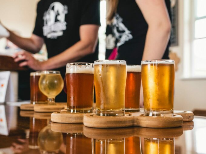 selection of glasses with different drinks laid out on surface