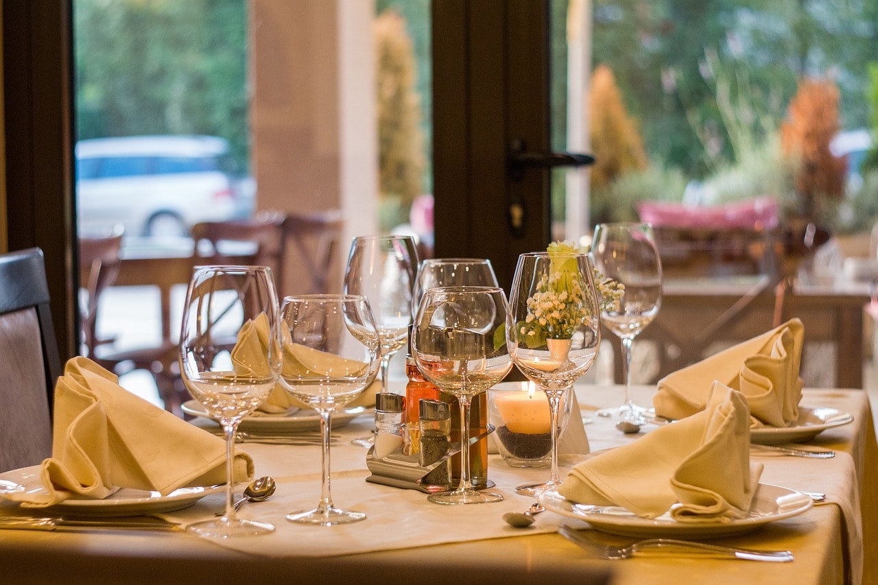 table set at restaurant with wine glasses